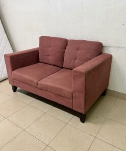 A red or dark pink two-seater fabric sofa featuring wide armrests and back cushions adorned with a checkered pattern. - Image 4