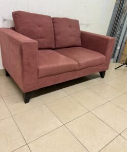 A red or dark pink two-seater fabric sofa featuring wide armrests and back cushions adorned with a checkered pattern. - Image 7