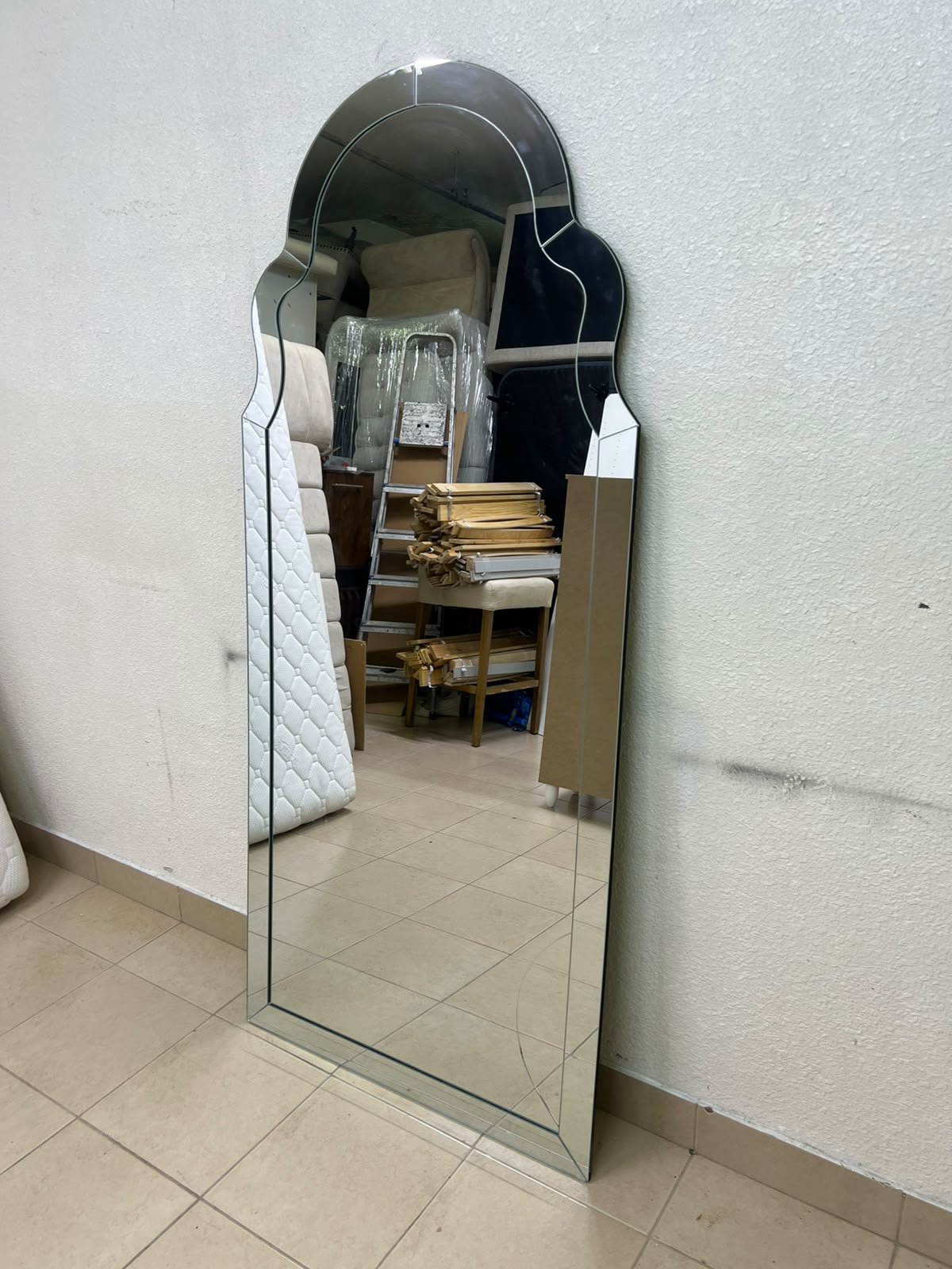 The arched, beveled-edge floor mirror—resembling the Bonnie mirror from Centrepoint—features elegant curved details that add visual depth and a sophisticated touch to any space. - Image 2