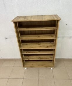 The wooden shoe cabinet, featuring open shelves and small white legs, is a practical and stylish piece for organizing the entryway. - Image 2