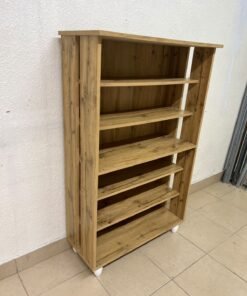 The wooden shoe cabinet, featuring open shelves and small white legs, is a practical and stylish piece for organizing the entryway. - Image 4