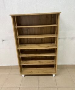 The wooden shoe cabinet, featuring open shelves and small white legs, is a practical and stylish piece for organizing the entryway. - Image 5