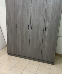 The image shows the Jamora four-door wardrobe from Danube Home, featuring a warm grey color and a practical design with hinged doors and simple black handles. - Image 2