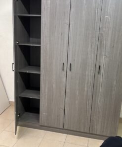 The image shows the Jamora four-door wardrobe from Danube Home, featuring a warm grey color and a practical design with hinged doors and simple black handles. - Image 6