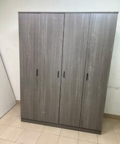 The image shows the Jamora four-door wardrobe from Danube Home, featuring a warm grey color and a practical design with hinged doors and simple black handles. - Image 7
