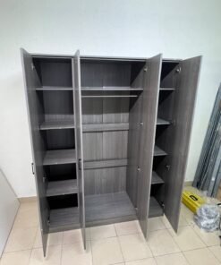 The image shows the Jamora four-door wardrobe from Danube Home, featuring a warm grey color and a practical design with hinged doors and simple black handles. - Image 10