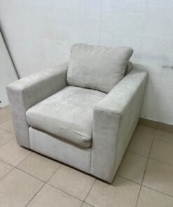 The single chair, upholstered in light gray fabric, resembles modern seating designs characterized by wide, comfortable armrests. - Image 5