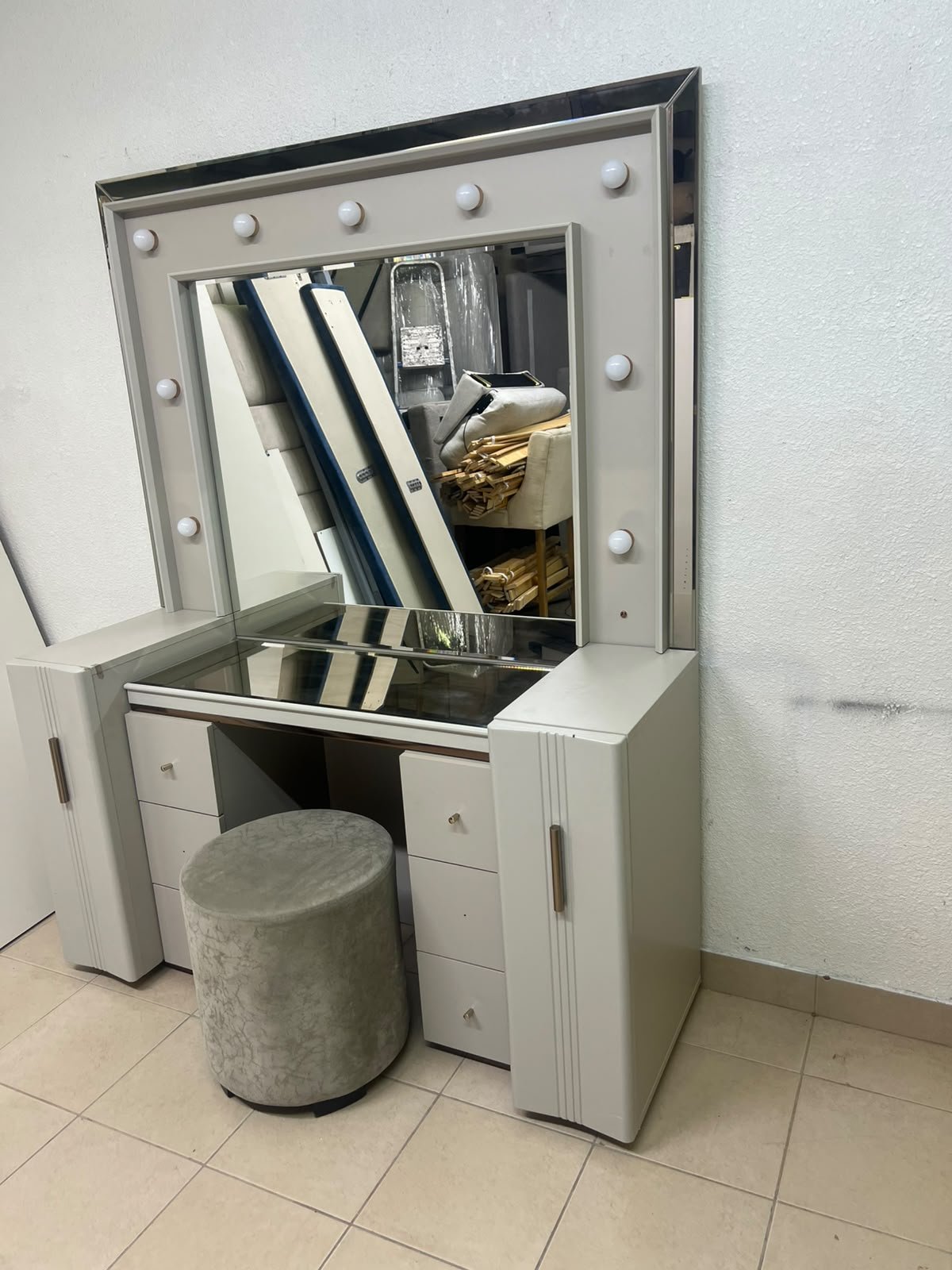 A beige Home Centre vanity table featuring a modern design, ambient mirror lighting, and an elegant round velvet stool. - Image 7