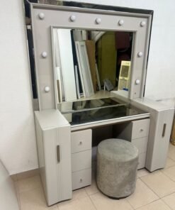 A beige Home Centre vanity table featuring a modern design, ambient mirror lighting, and an elegant round velvet stool. - Image 8