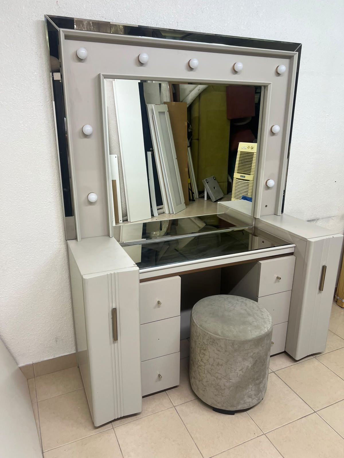 A beige Home Centre vanity table featuring a modern design, ambient mirror lighting, and an elegant round velvet stool. - Image 8