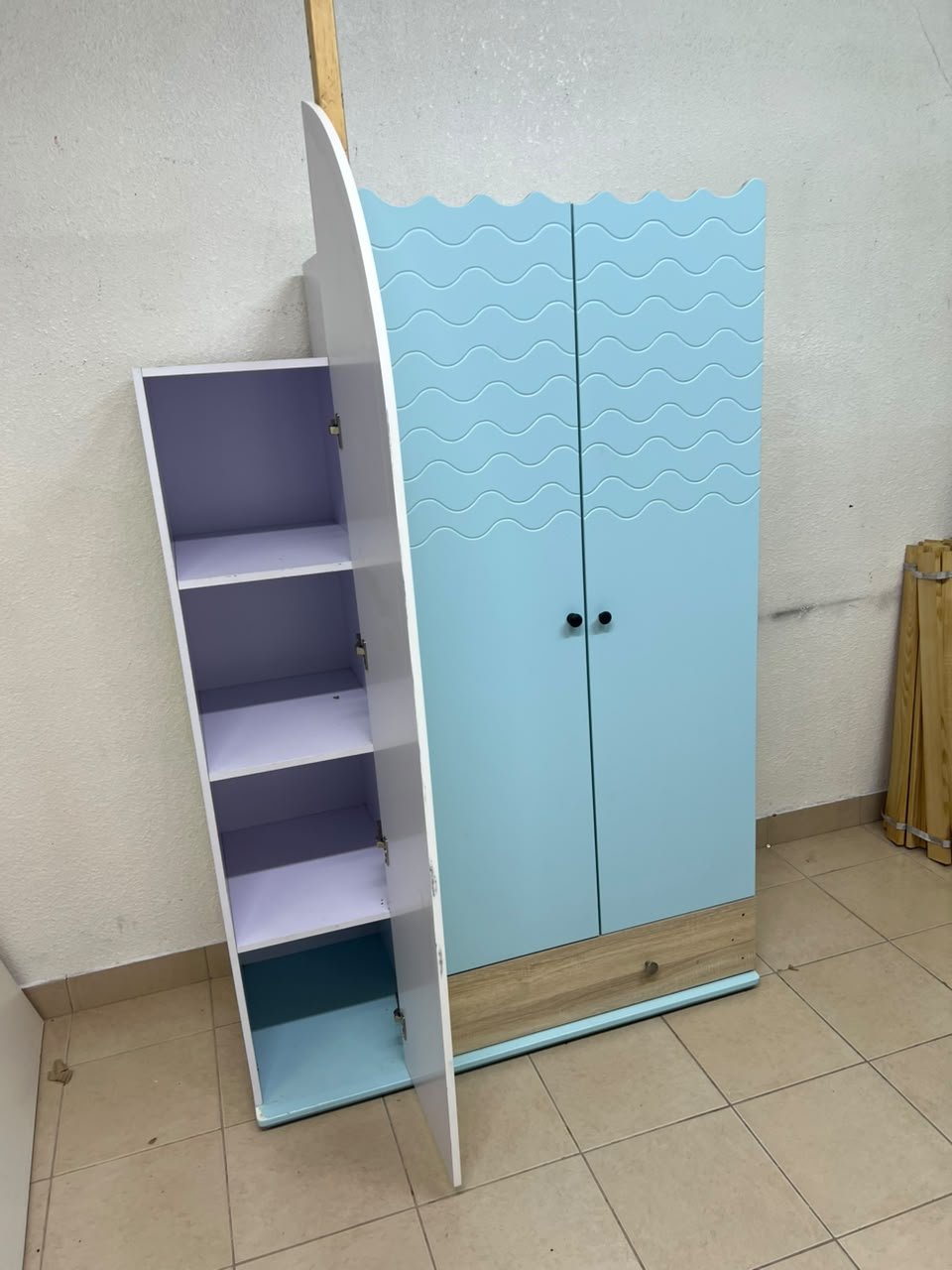 The photo shows a children's wardrobe with a distinctive nautical design in blue and white with wooden details and wave-like top edges. - Image 10