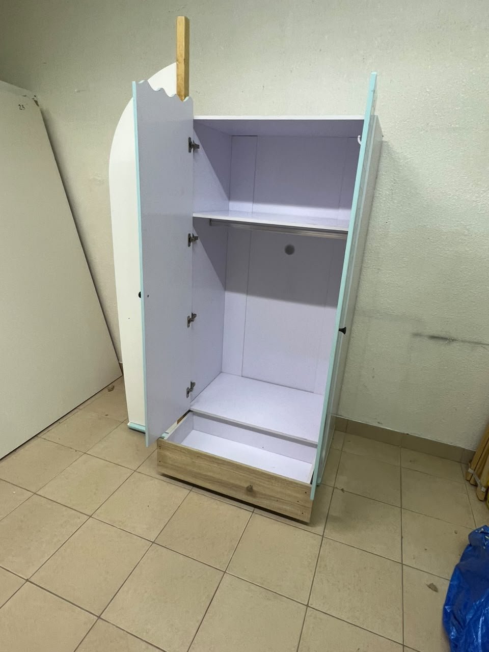 The photo shows a children's wardrobe with a distinctive nautical design in blue and white with wooden details and wave-like top edges. - Image 8