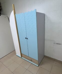 The photo shows a children's wardrobe with a distinctive nautical design in blue and white with wooden details and wave-like top edges. - Image 7