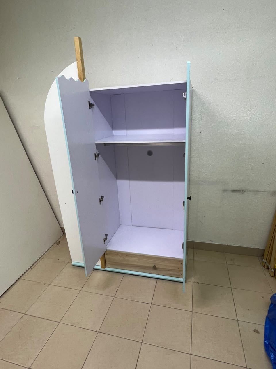 The photo shows a children's wardrobe with a distinctive nautical design in blue and white with wooden details and wave-like top edges. - Image 5