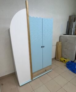 The photo shows a children's wardrobe with a distinctive nautical design in blue and white with wooden details and wave-like top edges. - Image 11