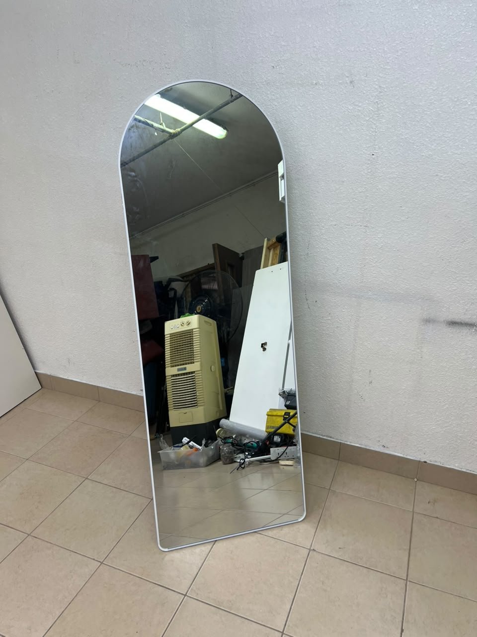 A full-length floor mirror featuring an arched design with a curved top, a white frame, and a black metal back stand; it resembles the Noon East arched mirrors available on Noon or similar freestanding mirror designs found on Amazon UAE. - Image 2
