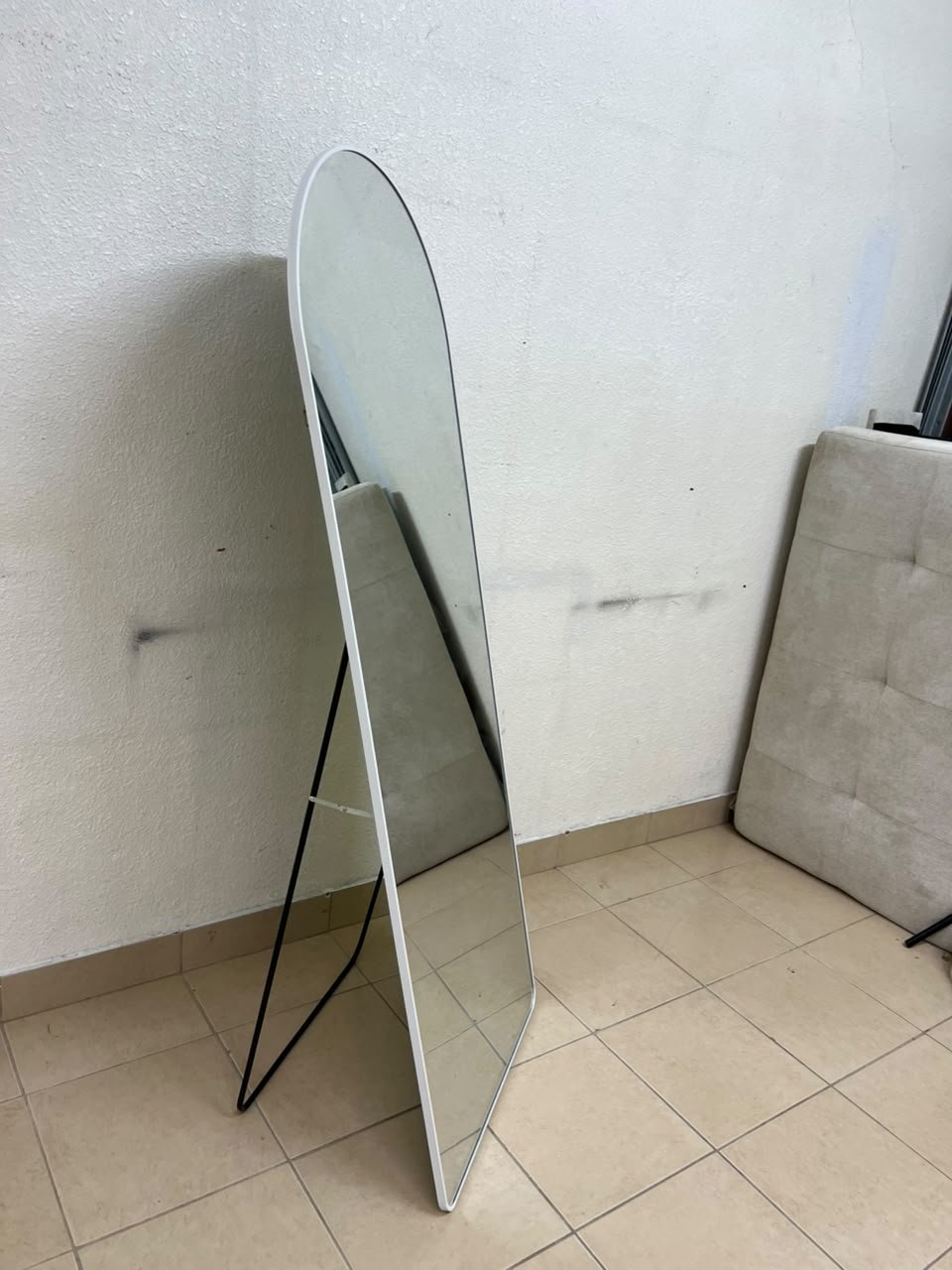 A full-length floor mirror featuring an arched design with a curved top, a white frame, and a black metal back stand; it resembles the Noon East arched mirrors available on Noon or similar freestanding mirror designs found on Amazon UAE. - Image 3