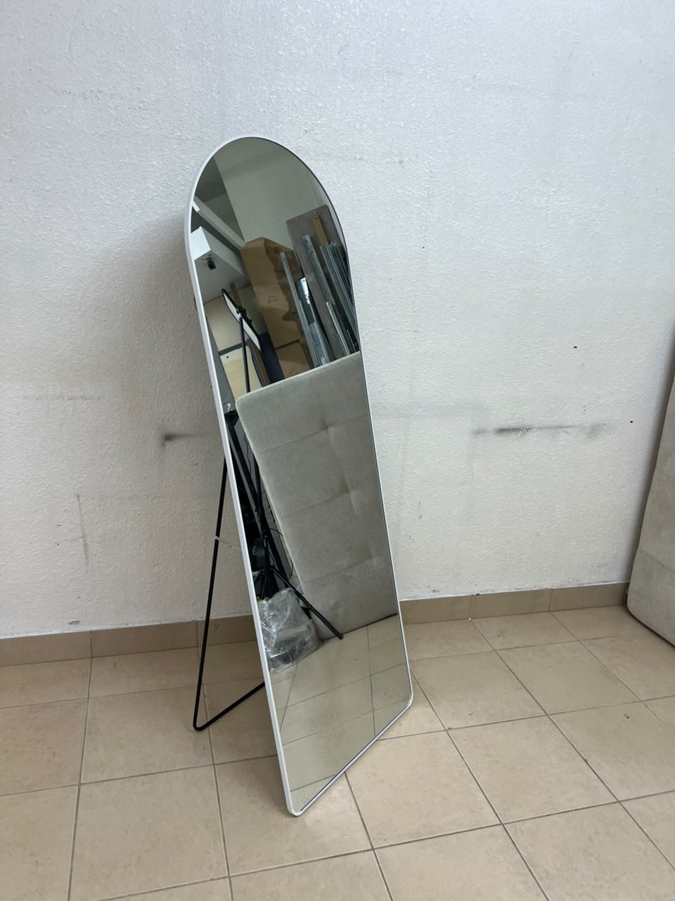 A full-length floor mirror featuring an arched design with a curved top, a white frame, and a black metal back stand; it resembles the Noon East arched mirrors available on Noon or similar freestanding mirror designs found on Amazon UAE. - Image 4