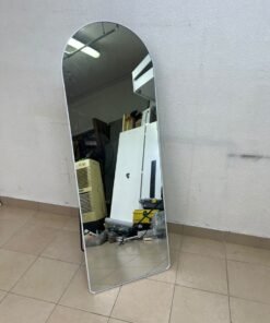 A full-length floor mirror featuring an arched design with a curved top, a white frame, and a black metal back stand; it resembles the Noon East arched mirrors available on Noon or similar freestanding mirror designs found on Amazon UAE. - Image 5