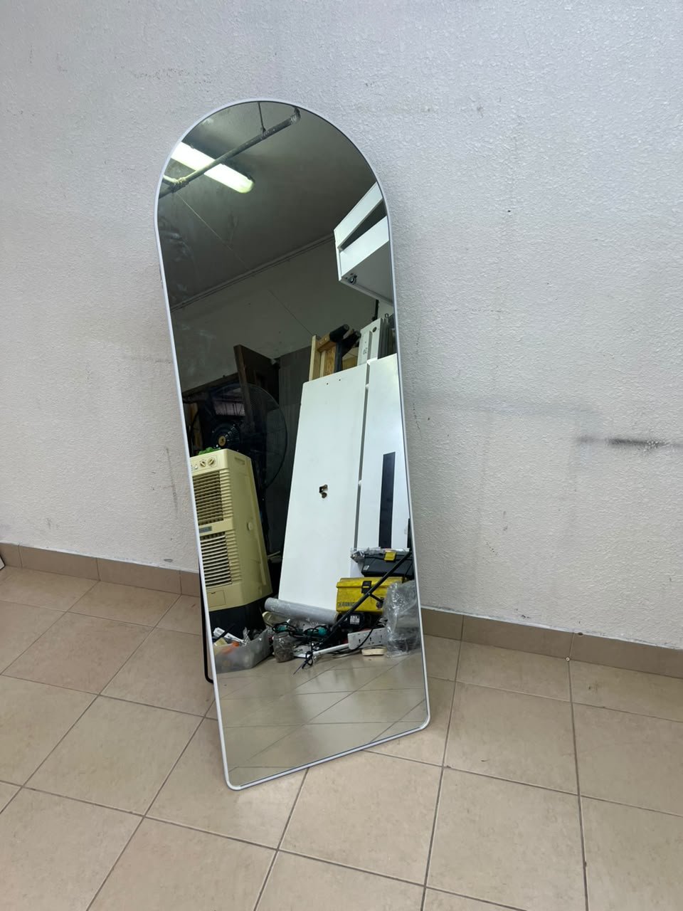 A full-length floor mirror featuring an arched design with a curved top, a white frame, and a black metal back stand; it resembles the Noon East arched mirrors available on Noon or similar freestanding mirror designs found on Amazon UAE. - Image 5