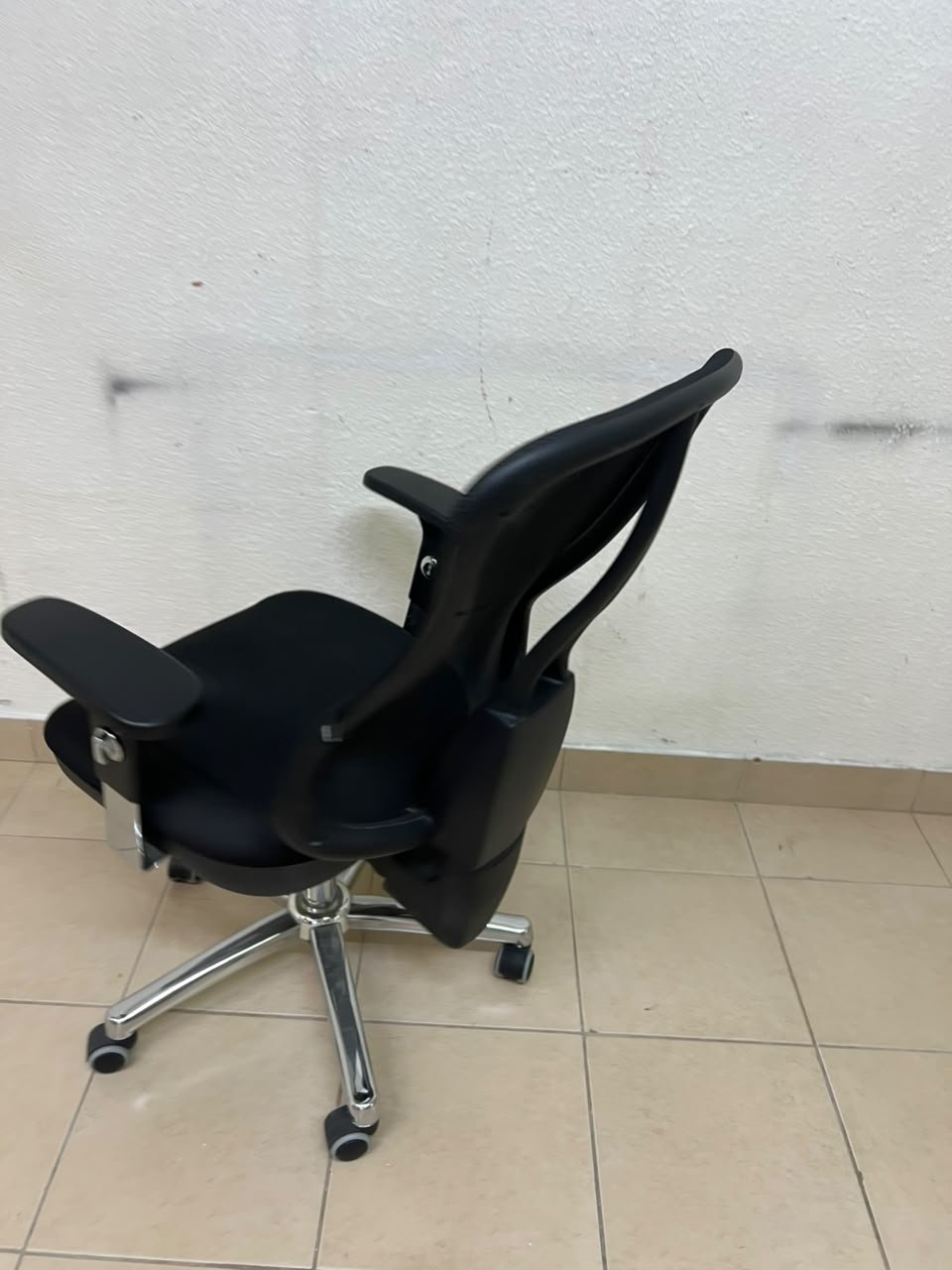 The Topstar Head Point is a comfortable office chair featuring a breathable black mesh back with built-in lumbar support and a shiny silver metal base. - Image 5