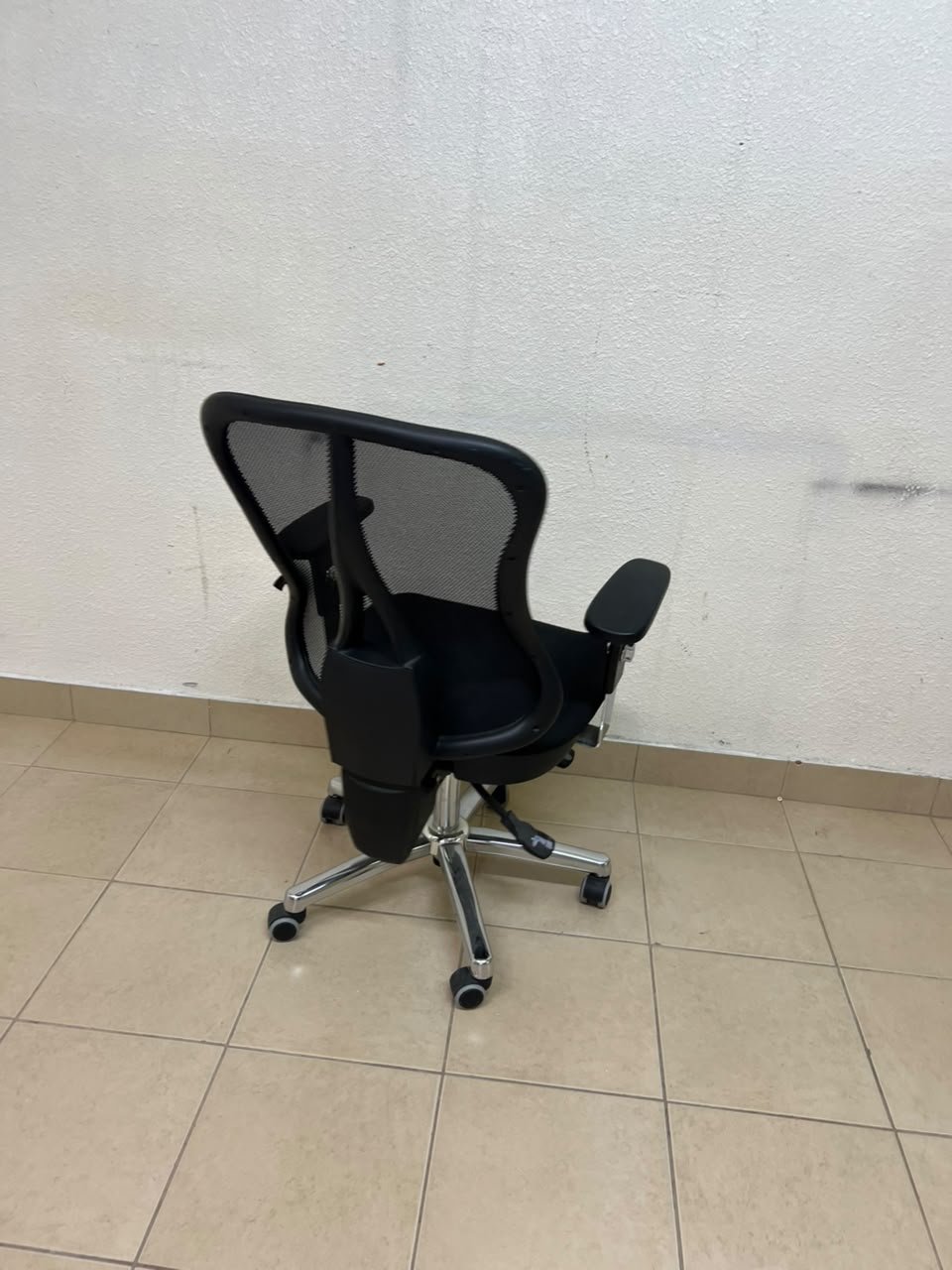 The Topstar Head Point is a comfortable office chair featuring a breathable black mesh back with built-in lumbar support and a shiny silver metal base. - Image 8