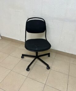 A comfortable office chair featuring a black backrest, built-in lumbar support, and a metal base.