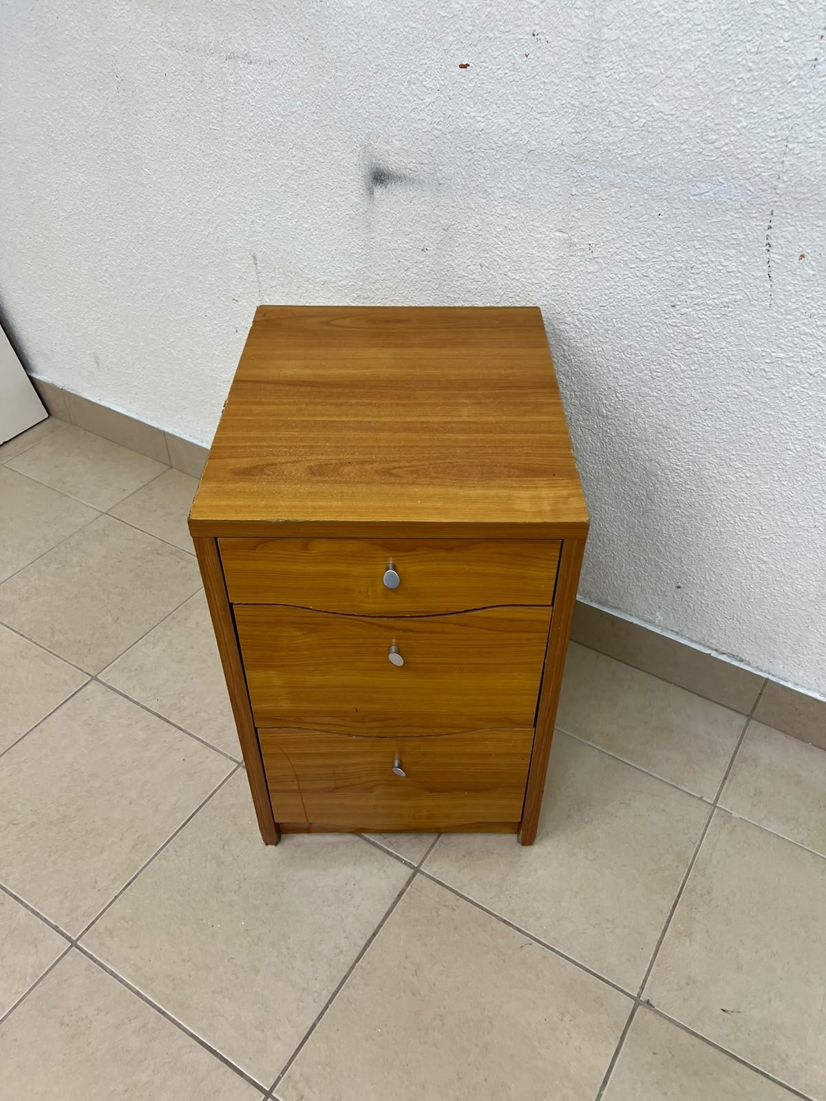 A wooden side table (nightstand) featuring three drawers with slightly curved fronts and small, round handles. - Image 6