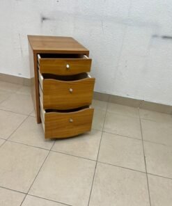 A wooden side table (nightstand) featuring three drawers with slightly curved fronts and small, round handles. - Image 3