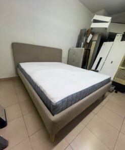 An IKEA bed with a foam and spring mattress—resembling the VALEVÅG or VESTERÖY models—featuring an upholstered bed frame in light gray or beige. - Image 5