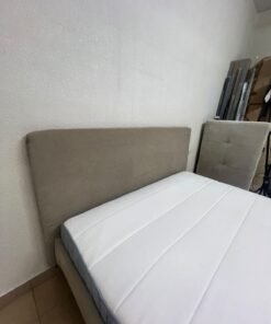 An IKEA bed with a foam and spring mattress—resembling the VALEVÅG or VESTERÖY models—featuring an upholstered bed frame in light gray or beige. - Image 8