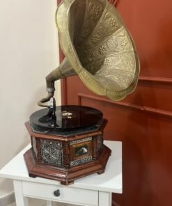 A vintage-style gramophone featuring an octagonal wooden base adorned with hand-engraved metalwork and a large, ornate brass horn, bearing the famous "His Master's Voice" logo. - Image 16