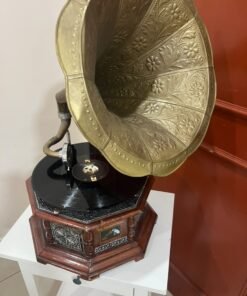 A vintage-style gramophone featuring an octagonal wooden base adorned with hand-engraved metalwork and a large, ornate brass horn, bearing the famous "His Master's Voice" logo. - Image 5
