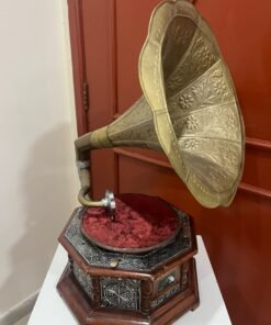 A vintage-style gramophone featuring an octagonal wooden base adorned with hand-engraved metalwork and a large, ornate brass horn, bearing the famous "His Master's Voice" logo. - Image 7
