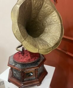A vintage-style gramophone featuring an octagonal wooden base adorned with hand-engraved metalwork and a large, ornate brass horn, bearing the famous "His Master's Voice" logo. - Image 2