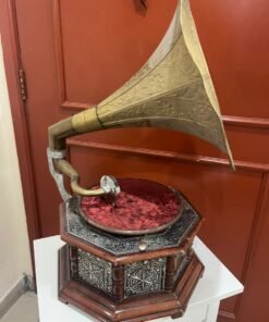 A vintage-style gramophone featuring an octagonal wooden base adorned with hand-engraved metalwork and a large, ornate brass horn, bearing the famous "His Master's Voice" logo. - Image 4