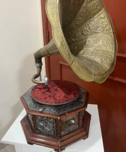 A vintage-style gramophone featuring an octagonal wooden base adorned with hand-engraved metalwork and a large, ornate brass horn, bearing the famous "His Master's Voice" logo. - Image 8