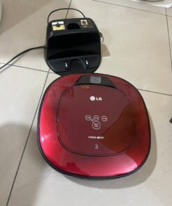 Red square-shaped robotic vacuum cleaner by LG (model LG Hom-Bot VR6270LVMB) with its charging base. - Image 4
