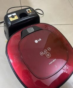Red square-shaped robotic vacuum cleaner by LG (model LG Hom-Bot VR6270LVMB) with its charging base. - Image 2