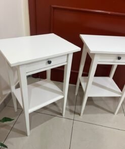 Two white IKEA HEMNES bedside tables (approximately 46x35 cm) made of solid wood.