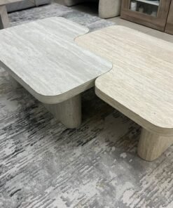 A modern two-piece coffee table set featuring an interlocking geometric design in beige, with a pattern that mimics stone or travertine. - Image 10