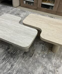 A modern two-piece coffee table set featuring an interlocking geometric design in beige, with a pattern that mimics stone or travertine. - Image 6