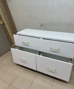 A modern, low-profile white chest of drawers (dresser) featuring a soft white finish, four spacious drawers (or double-fronted drawers), and gold or copper-toned pulls, all set on raised white legs. The design resembles contemporary storage units like the IKEA BESTÅ system or similar four-drawer cabinets. - Image 7