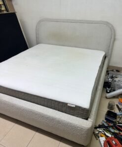 Modern upholstered double bed (featuring curved lines on the headboard and frame, covered in a textured fabric—such as bouclé, borg, or a woven textile—in a light beige or off-white shade), with a white top mattress resting on the bed base. 180x200 cm. - Image 2