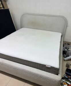 Modern upholstered double bed (featuring curved lines on the headboard and frame, covered in a textured fabric—such as bouclé, borg, or a woven textile—in a light beige or off-white shade), with a white top mattress resting on the bed base. 180x200 cm. - Image 3