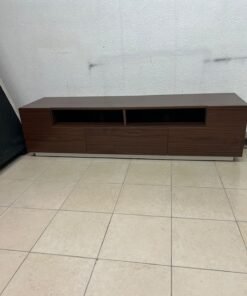 A modern wooden TV stand (media unit) in a dark brown (walnut) finish, featuring open shelves, three lower storage drawers, and a silver base.