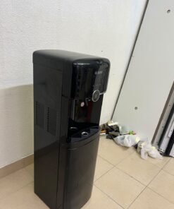 A black, freestanding water cooler from Sure—specifically a bottom-loading model (such as the SBL70 or SBL1970BP)—that allows the water bottle to be easily placed inside the bottom compartment. - Image 8