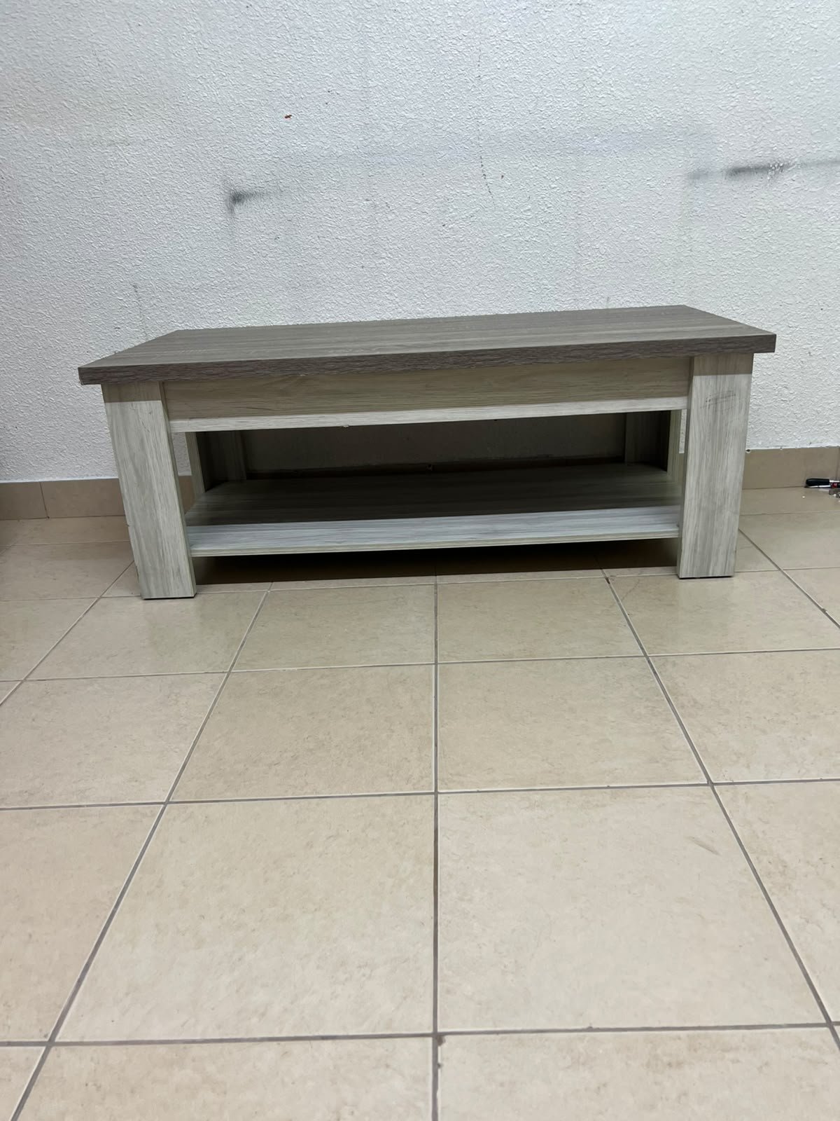 A rectangular coffee table made of engineered wood featuring a two-tone design; the tabletop comes in a greyish-brown wood finish, while the frame, legs, and lower shelf are white or light grey. It resembles the "Angelic" coffee table from Home Box. - Image 7