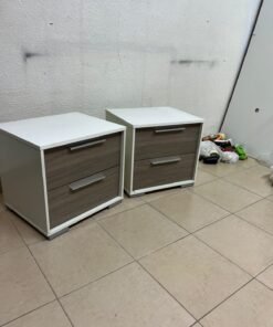 Two modern, two-tone (white and walnut/gray) bedside tables featuring two drawers and silver handles, similar to the "Marissa" or "Thomas" 2-drawer nightstands (white/walnut) available on the local market.