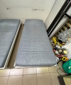 Two single beds with white metal frames, featuring lightweight foam mattresses in a light gray/blue color—similar to the ÅGOTNES foam mattress from IKEA. - Image 6